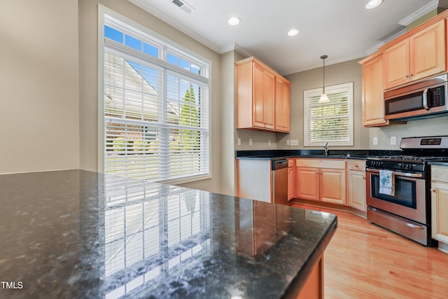 127 Bobwhite Way, Mebane, NC 27302 - kitchen with stainless steel appliances, ornamental molding, plenty of natural light, light brown cabinets, and recessed lighting
