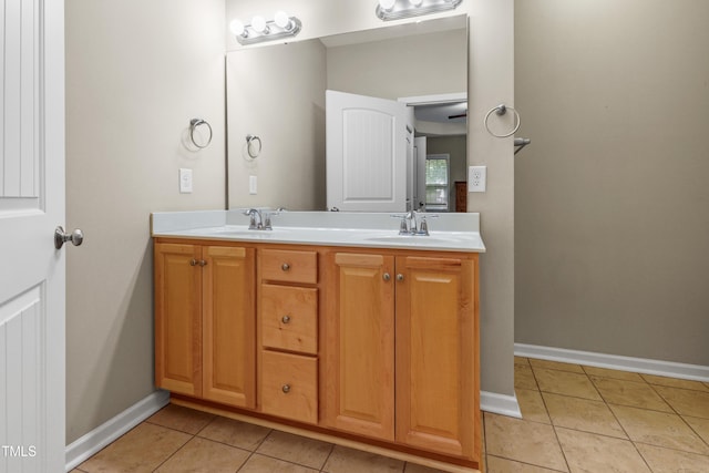 127 Bobwhite Way, Mebane, NC 27302 - full bathroom with tile patterned flooring, double vanity, and baseboards
