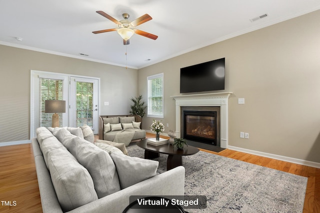 127 Bobwhite Way, Mebane, NC 27302 - living area featuring healthy amount of natural light, baseboards, a ceiling fan, ornamental molding, and wood finished floors