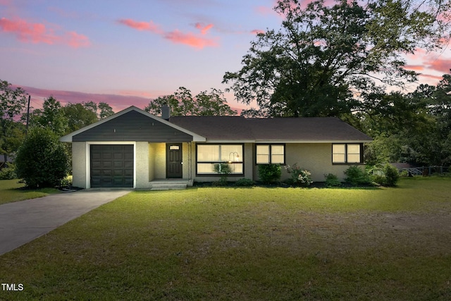 492 N Dunn St, Angier, NC 27501 - single story home with driveway, a garage, a yard, and stucco siding