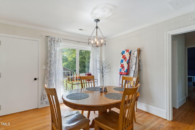 492 N Dunn St, Angier, NC 27501 - dining room with a chandelier, crown molding, and light wood-style flooring