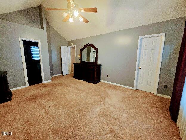 5301 Peacenest Dr, Raleigh, NC 27610 - unfurnished bedroom with carpet, baseboards, high vaulted ceiling, and a ceiling fan