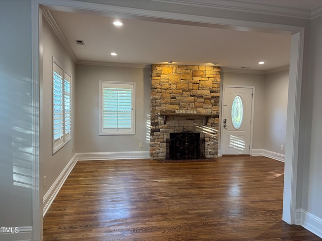 119 W Vernon Ave, Wake Forest, NC 27587 - unfurnished living room with crown molding, dark wood finished floors, a stone fireplace, baseboards, and recessed lighting