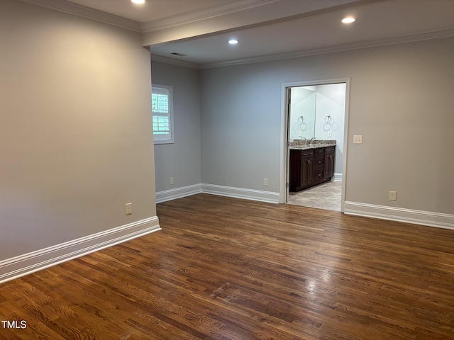 119 W Vernon Ave, Wake Forest, NC 27587 - spare room featuring baseboards, ornamental molding, wood finished floors, and recessed lighting