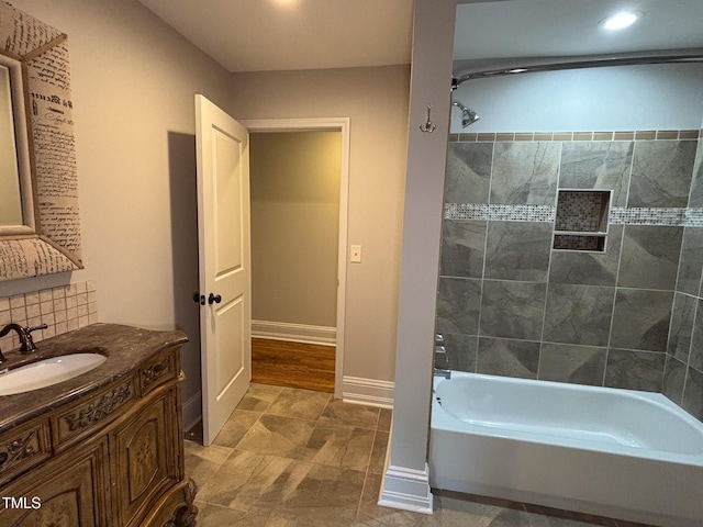 119 W Vernon Ave, Wake Forest, NC 27587 - full bath with vanity, tub / shower combination, tasteful backsplash, recessed lighting, and baseboards