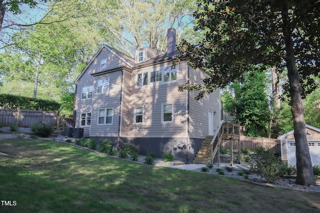 119 W Vernon Ave, Wake Forest, NC 27587 - view of side of property featuring stairs, a chimney, and an outbuilding