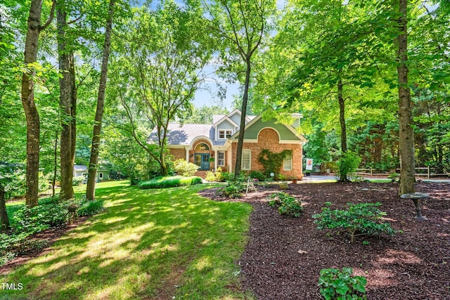7401 Heartland Dr, Wake Forest, NC 27587 - view of front of house with brick siding and a front yard