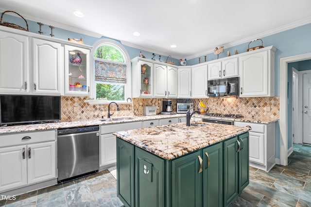 7401 Heartland Dr, Wake Forest, NC 27587 - kitchen featuring stainless steel dishwasher, black microwave, green cabinetry, a sink, and white cabinets