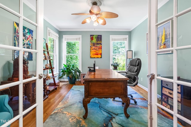 7401 Heartland Dr, Wake Forest, NC 27587 - home office featuring french doors, wood finished floors, plenty of natural light, and ornamental molding