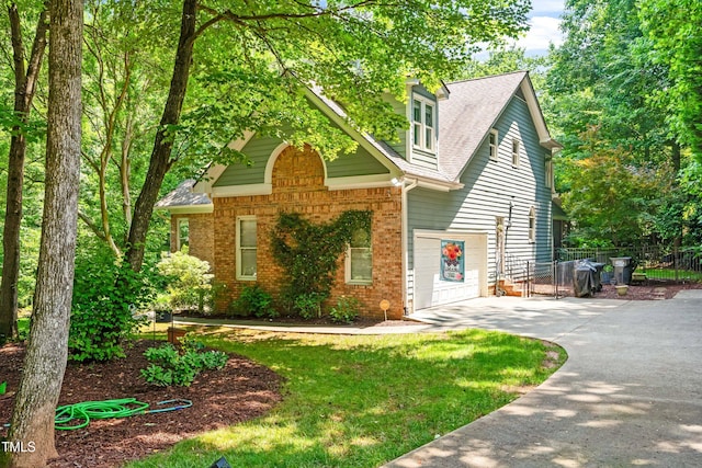 7401 Heartland Dr, Wake Forest, NC 27587 - view of front of home with driveway, brick siding, and a shingled roof