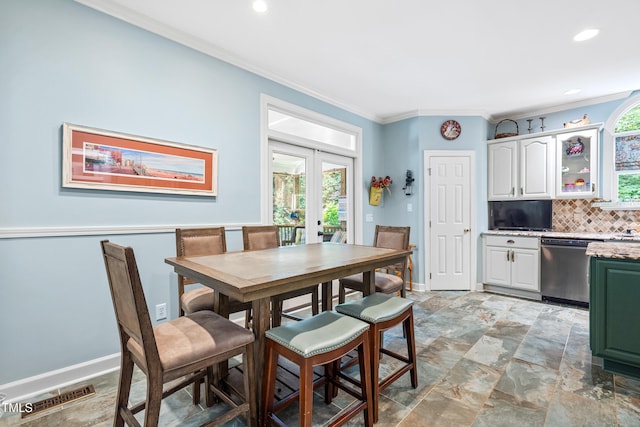 7401 Heartland Dr, Wake Forest, NC 27587 - dining area featuring french doors, crown molding, baseboards, recessed lighting, and light stone finish flooring