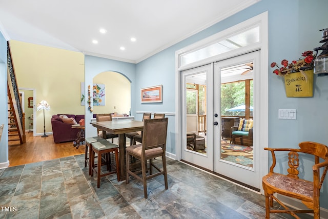 7401 Heartland Dr, Wake Forest, NC 27587 - dining area with french doors, ornamental molding, arched walkways, baseboards, and stone finish flooring