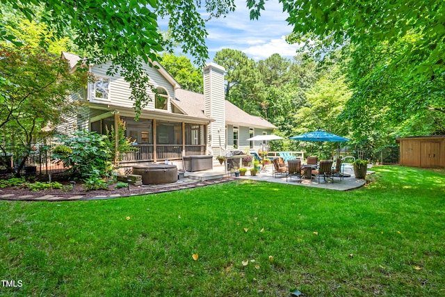 7401 Heartland Dr, Wake Forest, NC 27587 - back of property featuring a patio, a chimney, and a sunroom