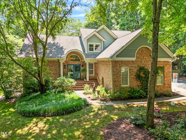 7401 Heartland Dr, Wake Forest, NC 27587 - view of front of property with brick siding and roof with shingles