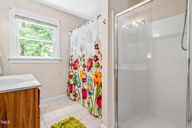 7401 Heartland Dr, Wake Forest, NC 27587 - bathroom with a stall shower, vanity, tile patterned floors, and baseboards