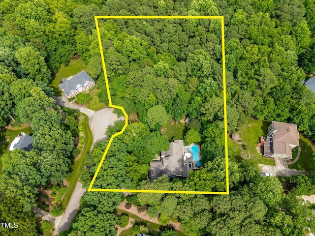 7401 Heartland Dr, Wake Forest, NC 27587 - view of property location with a forest and property parcel outlined