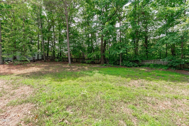 297 Curragh Cv, Fuquay Varina, NC 27526 - view of yard featuring a view of trees