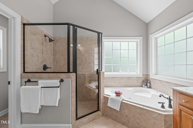 297 Curragh Cv, Fuquay Varina, NC 27526 - bathroom with a jetted tub, a stall shower, vaulted ceiling, and vanity