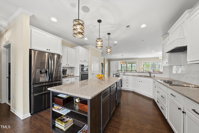 123 Turnstone Dr, Durham, NC 27703 - kitchen featuring appliances with stainless steel finishes, recessed lighting, white cabinetry, dark wood-type flooring, and crown molding