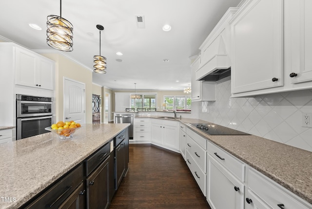 123 Turnstone Dr, Durham, NC 27703 - kitchen featuring stainless steel appliances, a sink, white cabinets, recessed lighting, and decorative backsplash