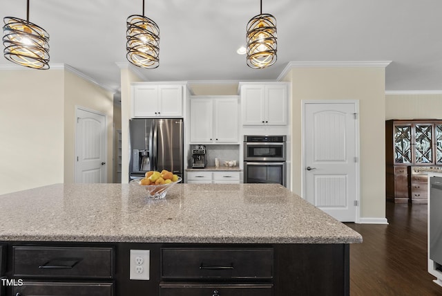 123 Turnstone Dr, Durham, NC 27703 - kitchen with stainless steel appliances, ornamental molding, dark wood finished floors, white cabinets, and light stone counters