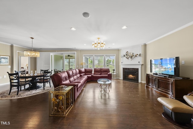 123 Turnstone Dr, Durham, NC 27703 - living area featuring a chandelier, ornamental molding, a fireplace, dark wood finished floors, and recessed lighting