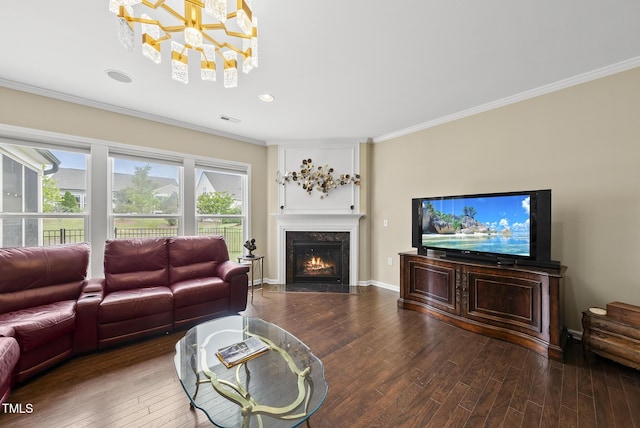 123 Turnstone Dr, Durham, NC 27703 - living room featuring wood finished floors, a chandelier, crown molding, a fireplace with flush hearth, and recessed lighting