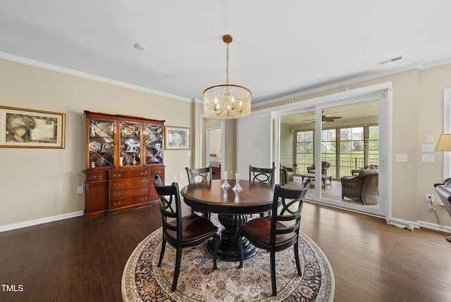 123 Turnstone Dr, Durham, NC 27703 - dining area featuring crown molding, dark wood-style flooring, a chandelier, and baseboards