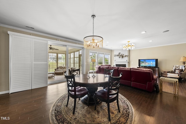 123 Turnstone Dr, Durham, NC 27703 - dining area featuring a chandelier, dark wood-type flooring, crown molding, and recessed lighting