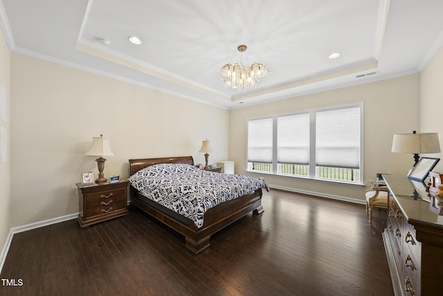 123 Turnstone Dr, Durham, NC 27703 - bedroom with a raised ceiling, a chandelier, dark wood finished floors, baseboards, and ornamental molding