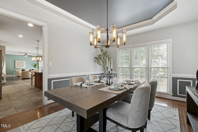 825 Highwater Pl, Fuquay Varina, NC 27526 - dining room with a chandelier, wainscoting, crown molding, wood finished floors, and recessed lighting