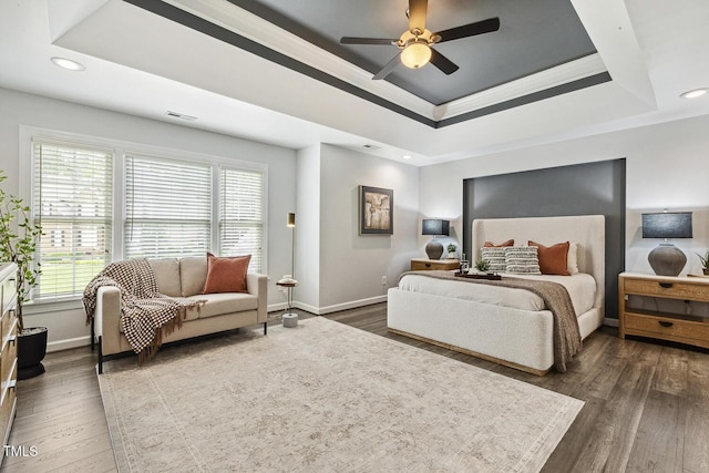 825 Highwater Pl, Fuquay Varina, NC 27526 - bedroom featuring a raised ceiling, multiple windows, dark wood-style flooring, recessed lighting, and a ceiling fan