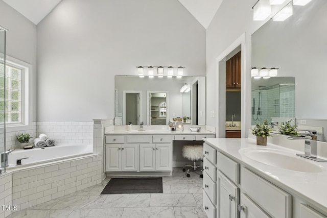 825 Highwater Pl, Fuquay Varina, NC 27526 - bathroom featuring high vaulted ceiling, a shower stall, two vanities, a bath, and marble finish floors