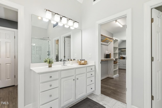 825 Highwater Pl, Fuquay Varina, NC 27526 - full bathroom featuring vanity, a stall shower, a walk in closet, and marble finish flooring