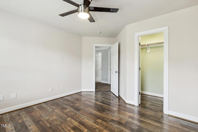 825 Highwater Pl, Fuquay Varina, NC 27526 - unfurnished bedroom featuring dark wood-style floors, a spacious closet, ceiling fan, and a closet