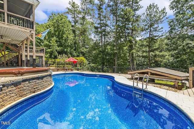 825 Highwater Pl, Fuquay Varina, NC 27526 - view of swimming pool featuring view of wooded area and stairway