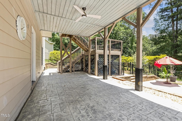 825 Highwater Pl, Fuquay Varina, NC 27526 - view of patio featuring stairway, ceiling fan, and view of scattered trees
