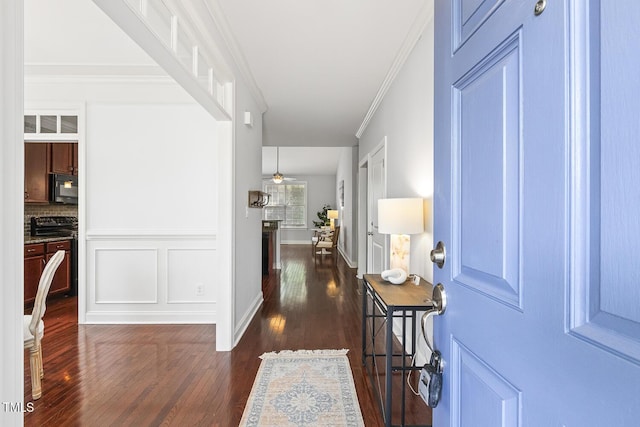 853 Bluffcreek Dr, Fuquay Varina, NC 27526 - foyer entrance featuring dark wood-style flooring, crown molding, and ceiling fan