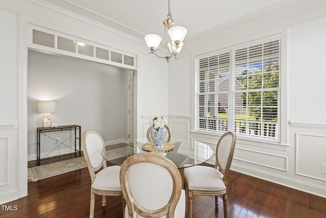 853 Bluffcreek Dr, Fuquay Varina, NC 27526 - dining area with dark wood-type flooring, a chandelier, a wainscoted wall, a decorative wall, and crown molding