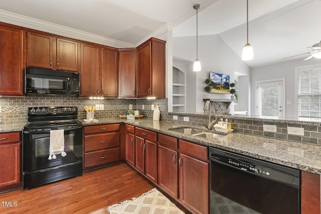 853 Bluffcreek Dr, Fuquay Varina, NC 27526 - kitchen featuring black appliances, wood finished floors, backsplash, stone counters, and vaulted ceiling