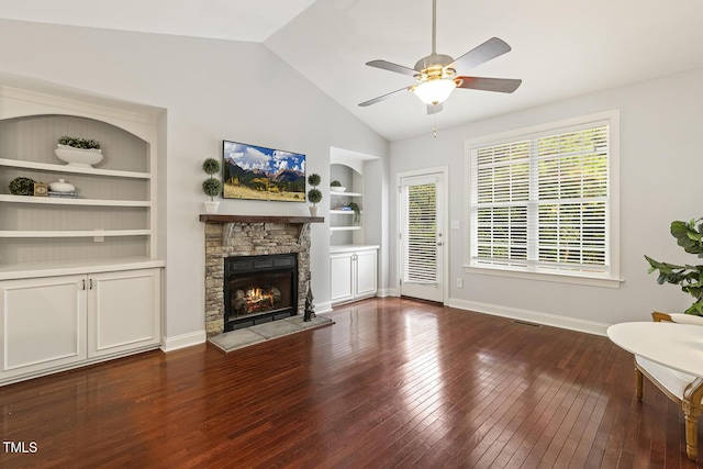 853 Bluffcreek Dr, Fuquay Varina, NC 27526 - unfurnished living room with built in shelves, hardwood / wood-style floors, ceiling fan, vaulted ceiling, and a fireplace