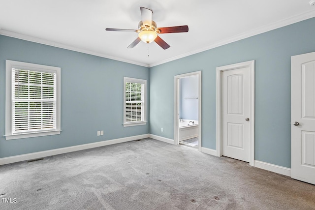 853 Bluffcreek Dr, Fuquay Varina, NC 27526 - unfurnished bedroom with carpet floors, crown molding, multiple windows, ensuite bath, and a ceiling fan
