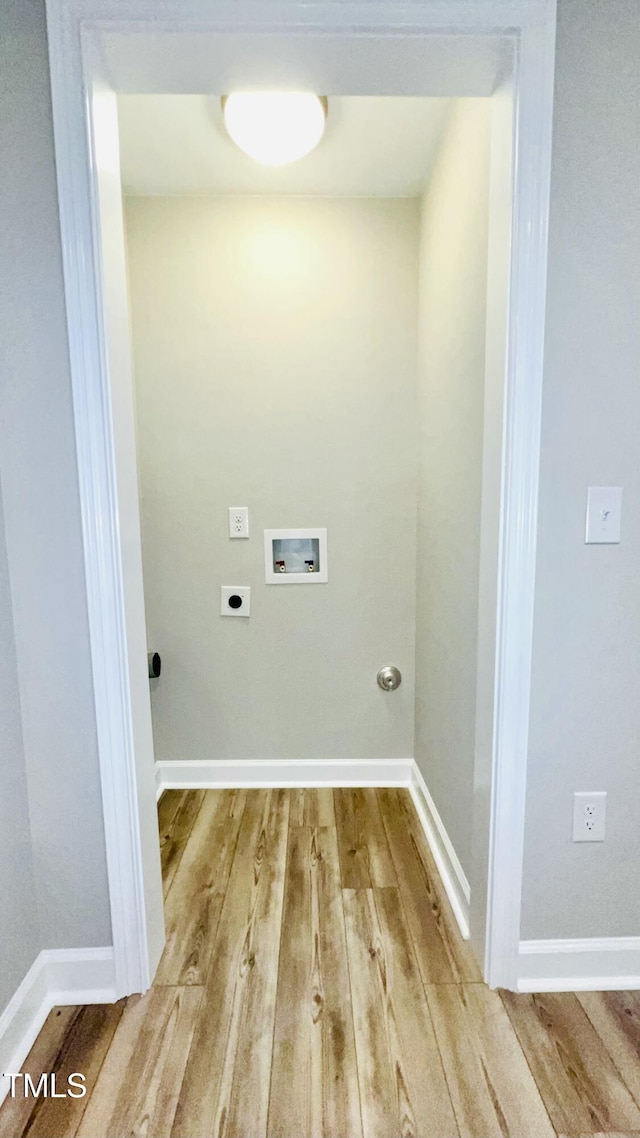 505 E Canary St, Dunn, NC 28334 - laundry room with electric dryer hookup, hookup for a washing machine, wood finished floors, and baseboards
