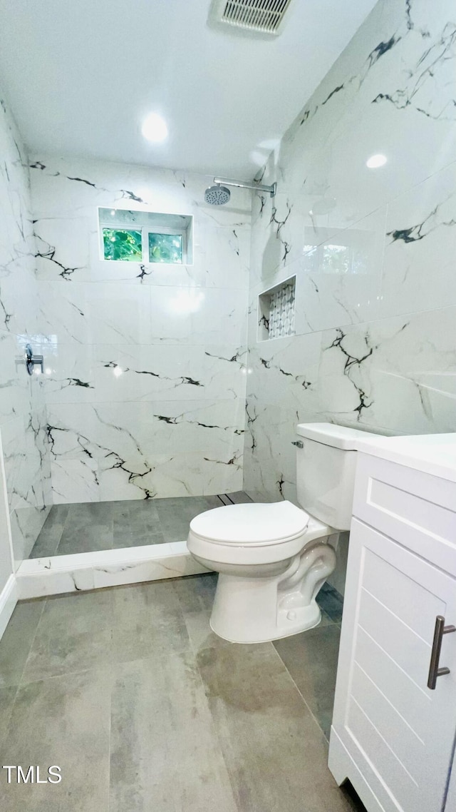 505 E Canary St, Dunn, NC 28334 - full bath with a marble finish shower, toilet, vanity, recessed lighting, and tile walls