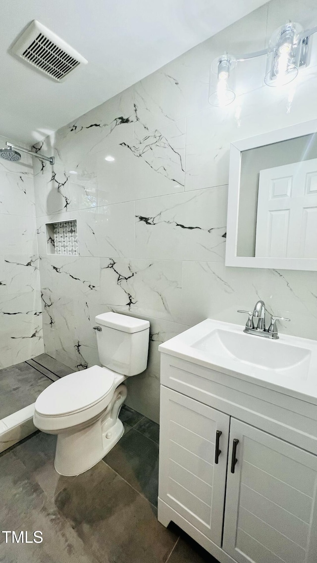 505 E Canary St, Dunn, NC 28334 - bathroom with a marble finish shower, vanity, toilet, and tile walls
