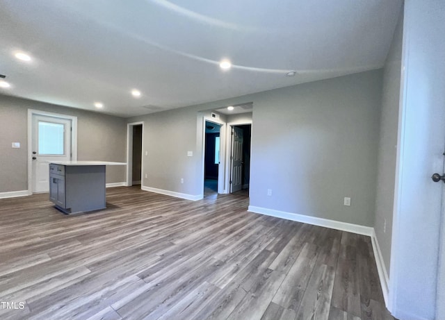 505 E Canary St, Dunn, NC 28334 - unfurnished living room with dark wood-type flooring, baseboards, and recessed lighting