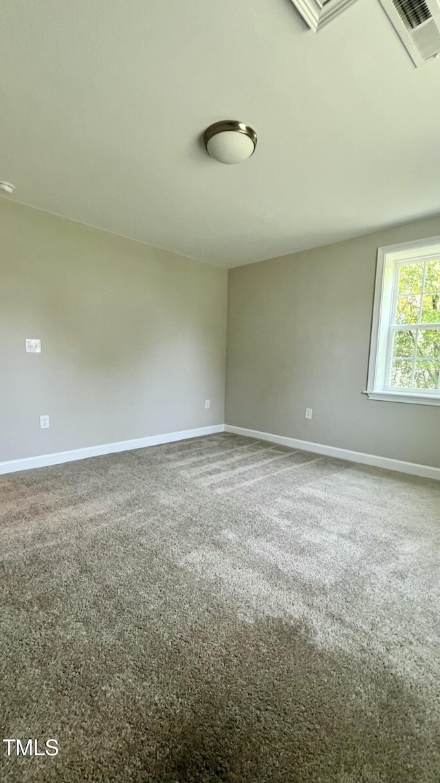505 E Canary St, Dunn, NC 28334 - unfurnished room featuring baseboards and carpet