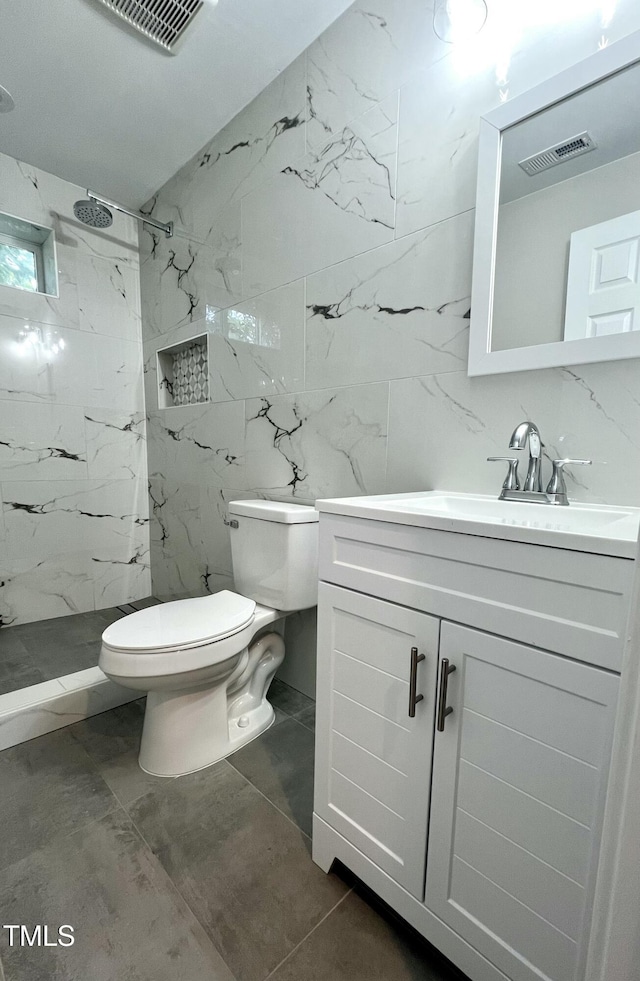 505 E Canary St, Dunn, NC 28334 - bathroom with vanity, a marble finish shower, toilet, tile walls, and marble finish floors