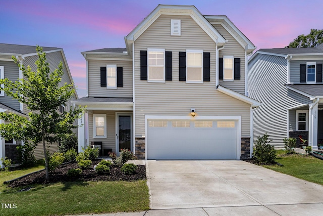 2128 Jollay St, Durham, NC 27703 - traditional-style home featuring concrete driveway, stone siding, and a garage