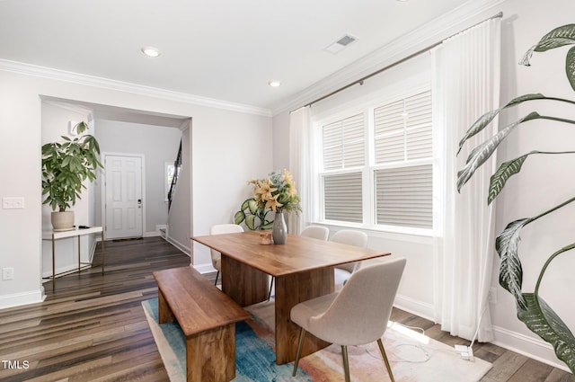 2128 Jollay St, Durham, NC 27703 - dining space featuring crown molding, wood finished floors, baseboards, recessed lighting, and healthy amount of natural light